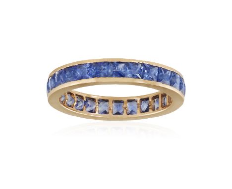A SAPPHIRE ETERNITY RINGComposed of a continuous row of French-cut sapphires, mounted in 18K rose gold, ring size MCondition 