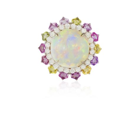 AN OPAL, COLOURED SAPPHIRE AND DIAMOND COCKTAIL RINGComposed of a central circular cabochon opal weighing approximately 26.00