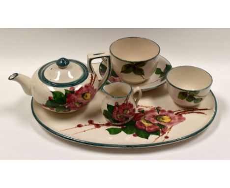LLANELLY POTTERY - five piece cabaret-size tea-service, comprising oval tray, teapot, cream jug, cup and saucer and sugar bas