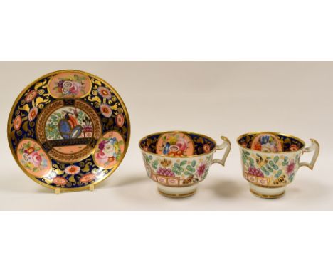 SWANSEA PORCELAIN - two cups and single saucer in pattern 219, decorated in underglaze cobalt blue, profusely gilded and with