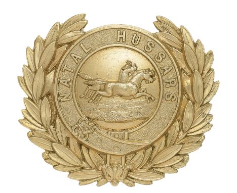 South Africa. Natal Hussars Victorian pre 1887 OR’s helmet plate.  A good die-stamped white metal example. Resting in laurel 