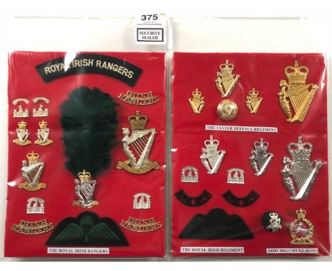 2 cards of Royal Irish Rangers, Ulster Defence and  Royal Irish Regiment insignia.  A good selection of mainly anodised cap b