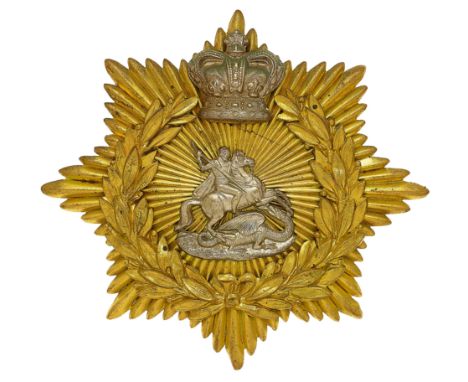 11th Middlesex (St. George's) Victorian helmet plate circa 1878-80.  A very fine scarce die-stamped brass example. Eight poin