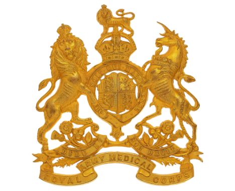 Royal Army Medical Corps Officer’s helmet plate circa 1901-14.   A fine gilt die-stamped example. Royal Arms, pierced around 