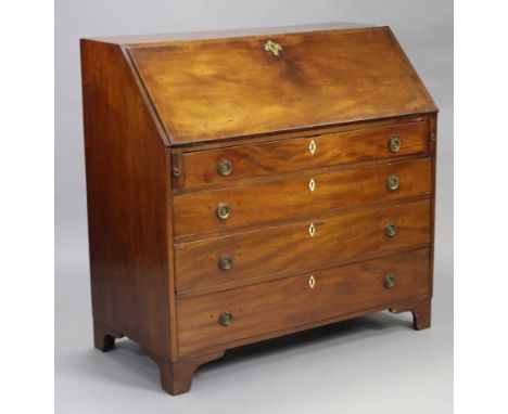 An 18th century mahogany bureau, with a fully fitted interior enclosed by a fall-front above four long graduated drawers with