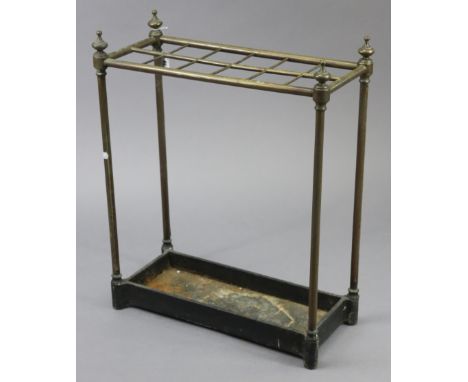 An Edwardian brass twelve-division umbrella stand, with drip-pan, 20” wide x 24½” high x 9” deep; A large coloured print titl