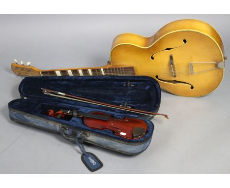 A Triumph six-string acoustic guitar; &amp; a Mayflower child’s violin &amp; bow, w.a.f., cased.