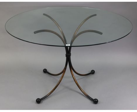 A contemporary wrought-iron breakfast table on four shaped legs &amp; with tempered-glass top, 48” diam. x 30” high; &amp; a 