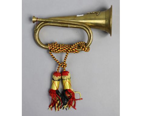 A reproduction brass bugle, 10¼” long.