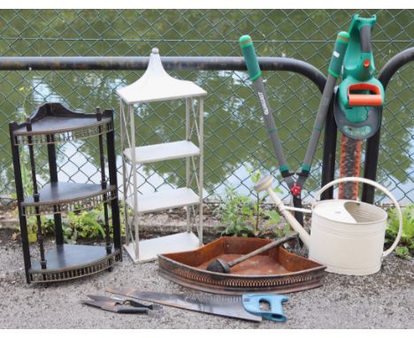 A white-finish aluminium watering can; a garden wall-mounted shelf-unit; various garden tools, etc. 