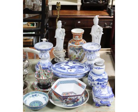 A Chinese pottery oval two-handled vegetable tureen with blue &amp; white floral decoration, 10” wide; a similar blue &amp; w