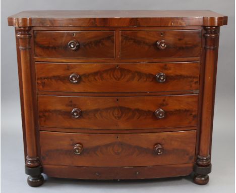 A Victorian mahogany bow-front chest, fitted two short &amp; three long graduated drawers with turned knob handles, with half