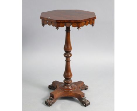 A 19th century rosewood tripod table with octagonal top, &amp; on a vase-turned centre column &amp; shaped platform base with