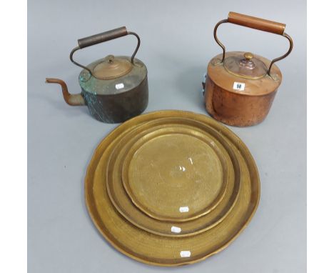 Two 19th century copper oval kettles, 13½”, &amp; 11¾” high; &amp; a set of three engraved brass graduated circular trays, 12