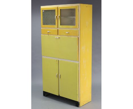 A mid-20th century white &amp; yellow painted wooden tall kitchen cabinet enclosed by a pair of glazed doors to the top above