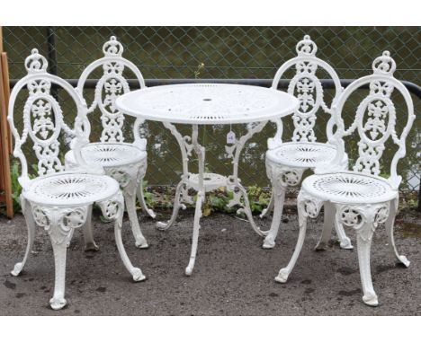 (LATE ADDITION) A white painted cast-iron garden table &amp; matching set of four chairs; table: 31.5" diam. x 27.75" high.