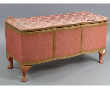 A pink painted Lloyd Loom-style serpentine-front ottoman with hinged lift-lid, &amp; on short cabriole legs, 36” wide x 19” h