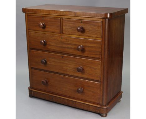 A Victorian mahogany chest fitted two short &amp; three long graduated drawers with turned knob handles, &amp; on a plinth ba