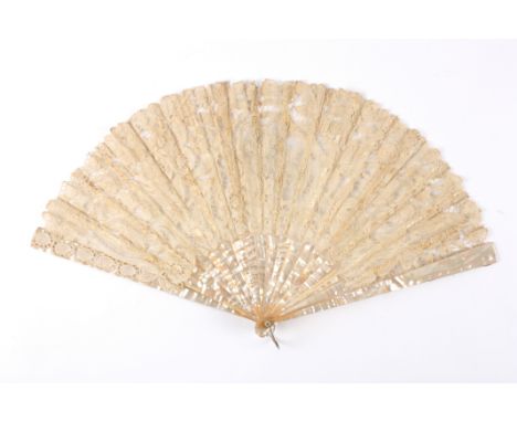 A mother-of-pearl and lace fan
with mother-of-pearl guard sticks and mother-of-pearl and bone sticks, decorated with cream la