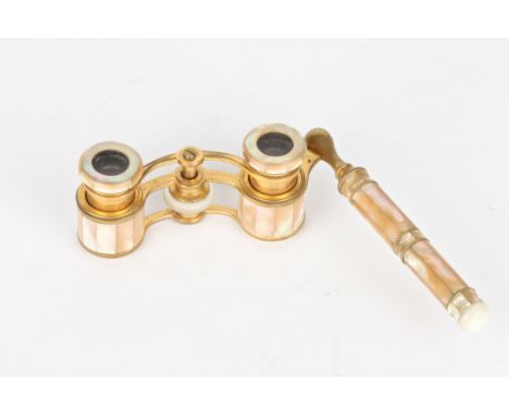 A pair of late 19th century French opera glasses
by Colmont of Paris, applied all over with segmented mother of pearl on a gi