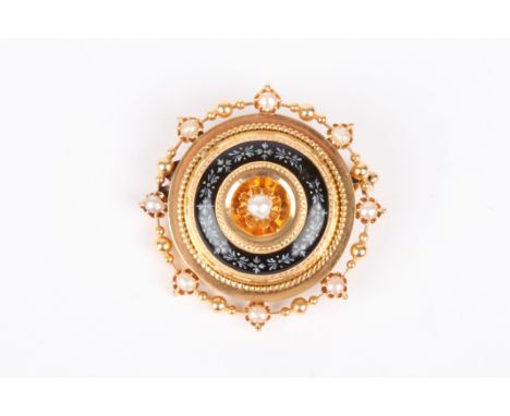 A 19th century circular gold coloured metal target brooch
surrounded by split pearls and black enamel decoration, with centra