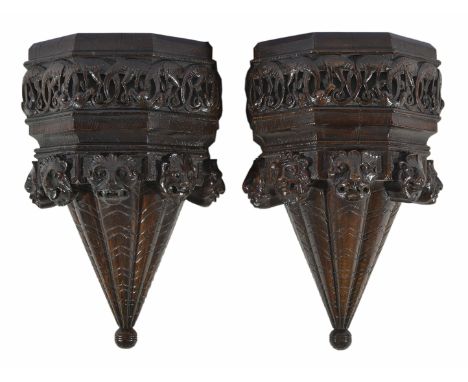 A pair of carved oak wall brackets
possibly late 17th century/early 18th century
the upper tier heavily carved with a frieze 