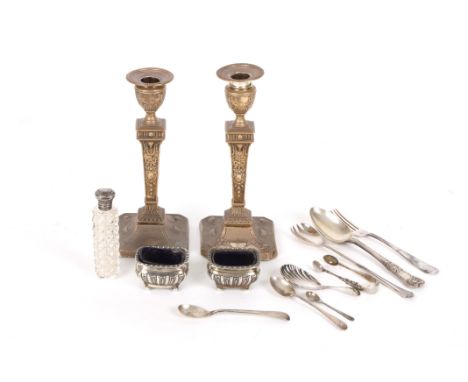 A small collection of silver
comprising a pair of weighted candlesticks, a pair of silver salts, a perfume bottle with hobnai