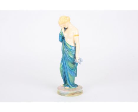 A Royal Worcester porcelain figure 'Sorrow' by James Hadley
formed as a young semi-nude woman in a robe, her hand clasped to 