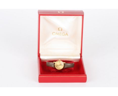 A ladies Omega wrist watch
the gilded dial with baton numerals, with 485 calibre movement and set in a plain gold plated case