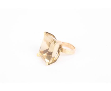 A large 14K gold and citrine dress ring
the faceted citrine of oblong form Dimensions: The citrine 2.5cm length, Size 'J'Cond