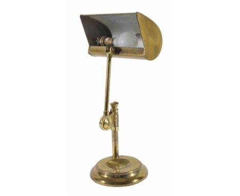 An adjustable brass desk lamp
on a circular baseDimensions: height 45cmCondition reportA little tarnished on the lower stem. 