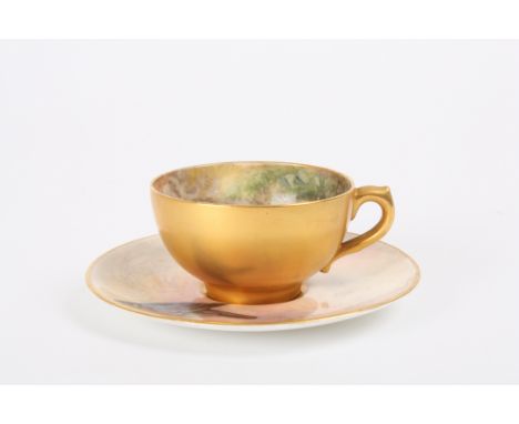 A matched Royal Worcester cup and saucer
the saucer decorated with a wood pigeon by James Stinton, the cup painted with fruit