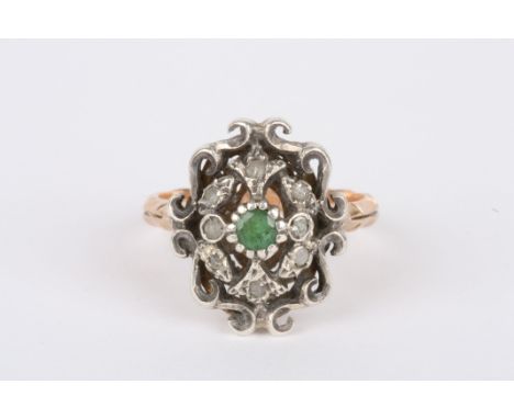 A 19th century Continental diamond and emerald ring
of shield form with centre emerald surrounded by rose diamonds in white m