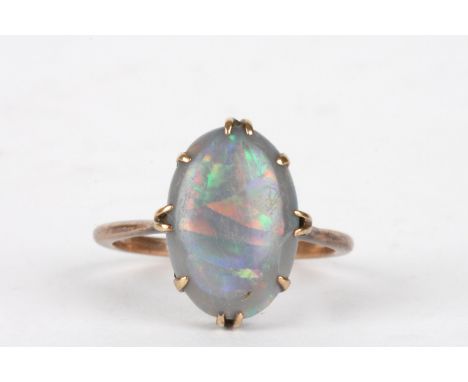 A 9ct gold and opal ring
the oval opal in an eight claw plain setting.Dimensions: Size N.Condition reportTarnished and some w