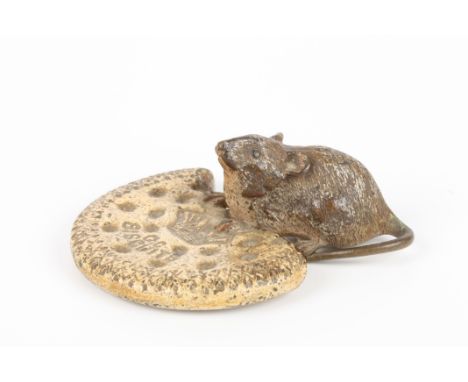 An early 20th century Austrian cold painted bronze mouse in the manner of Bergman
in a seated pose by a biscuit, impressed 'C