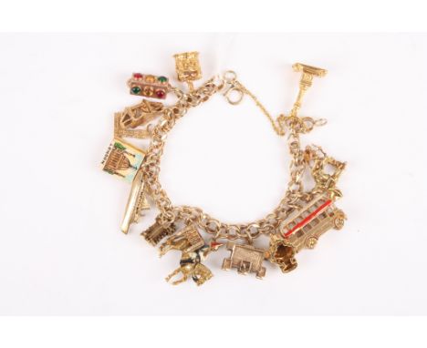 A 9ct gold charm bracelet 
with fifteen charms all of London landmarks including Nelson's Column, St Paul's Cathedral, London