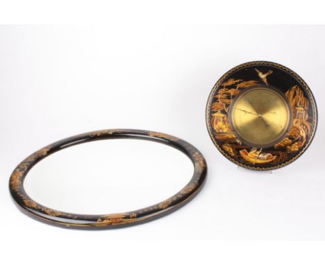 A Japanned aneroid barometer with a brass dial and similar mirror
retailed by A. R. Baines of Harrogate, the case heavily dec