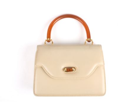 A 1970s Gucci leather handbag
the taupe leather bag with Gucci stamp to the interior, faux horn handle and claspDimensions: w