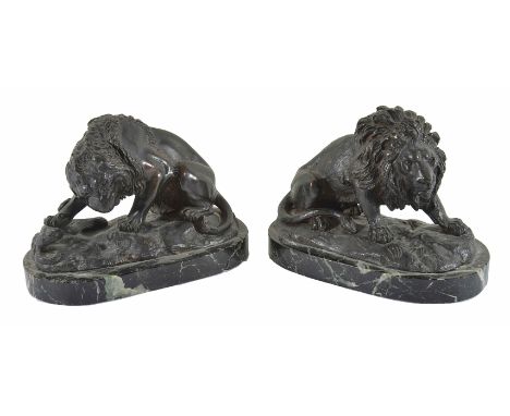 Two bronze lions probably French, late 19th century both in crouching poses, naturalistically cast, one attacking a serpent, 