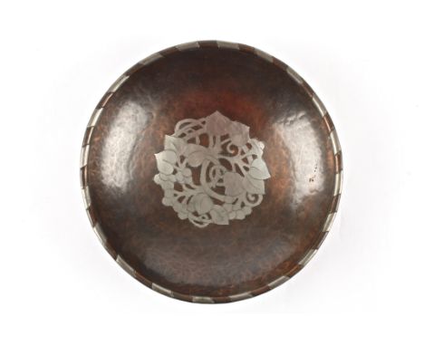 An Arts and Craft copper and pewter bowl by Hugh Wallis
signed on the reverse with his monogram HW, the rim interspersed with