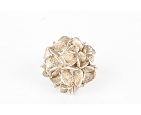 A Swedish Stigbert silver flower ring
formed as stylised petals on a looped shank, signed the shank.Dimensions: Size O.Condit