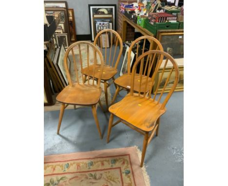 A set of three Ercol style hoop back chairs together with another similar chair. (4) 