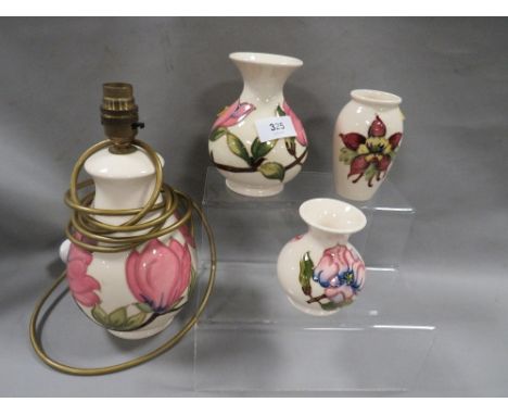 Four pieces of Moorcroft to include a table lamp 