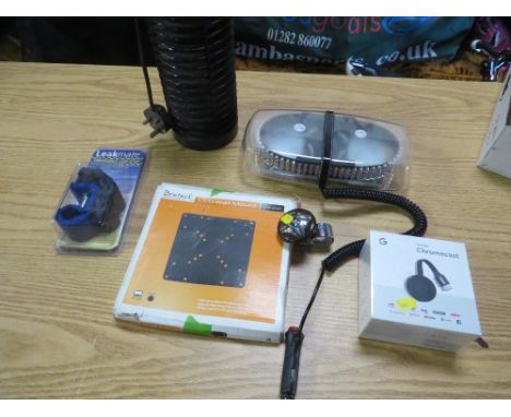 A tray of collectables to include an emergency car rook light and bug zapper, boxed Google Chromecast and an emergency leak s