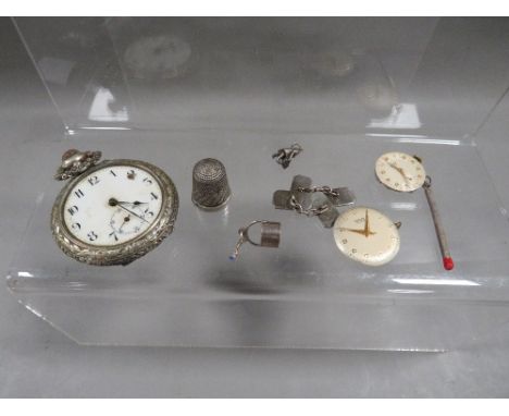 An antique pocket watch, silver cufflinks, charms etc
