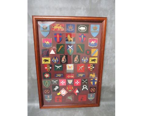 A FRAMED COLLECTION OF 52 BRITISH ARMY CLOTH FORMATION SIGN BADGES, to include Rhine troops, REME, 1st Division, Malta Garris