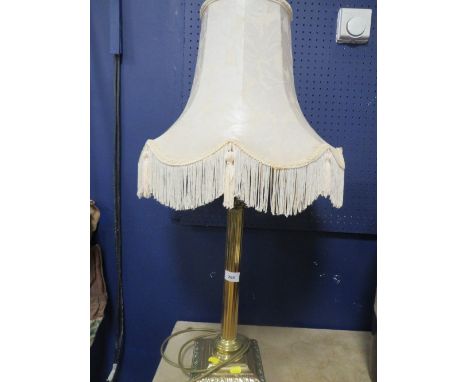 A brass table lamp with shade 