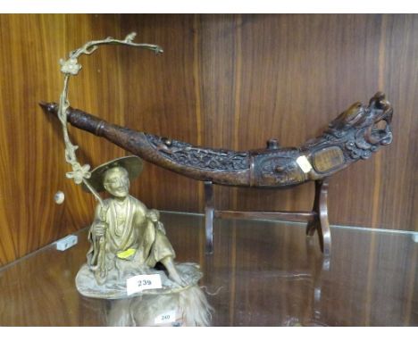 A gilt metal figurative tea light holder of a Chinese fisherman together with a decorative horn on stand A/F 