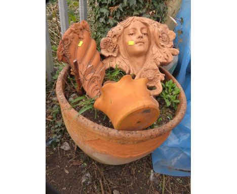 A vintage large terracotta planter and various wall hanging planters 