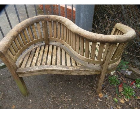 A chunky hardwood garden bench love seat 